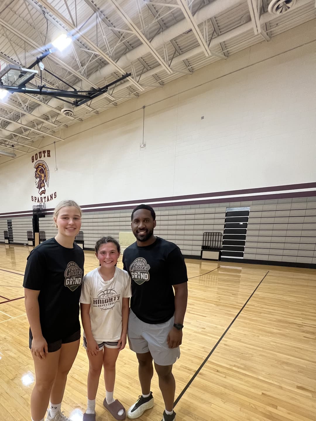 Coach Darrel Wilson with two Grace N Grind athletes after a session