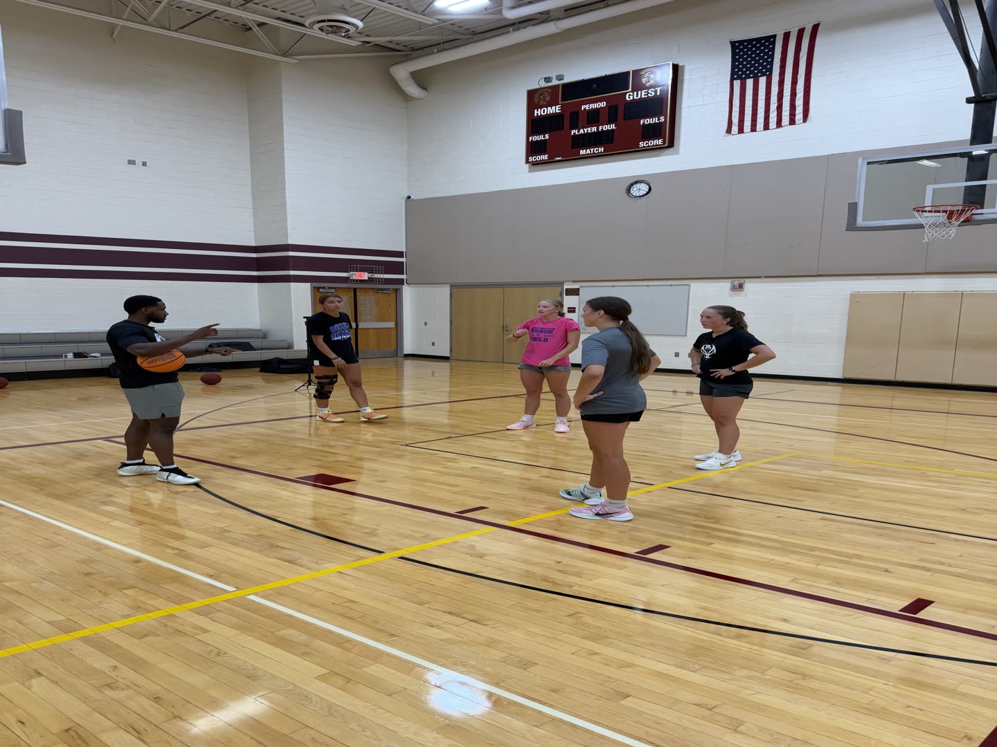 Coach Darrel teaching a group of older Grace N Grind athletes