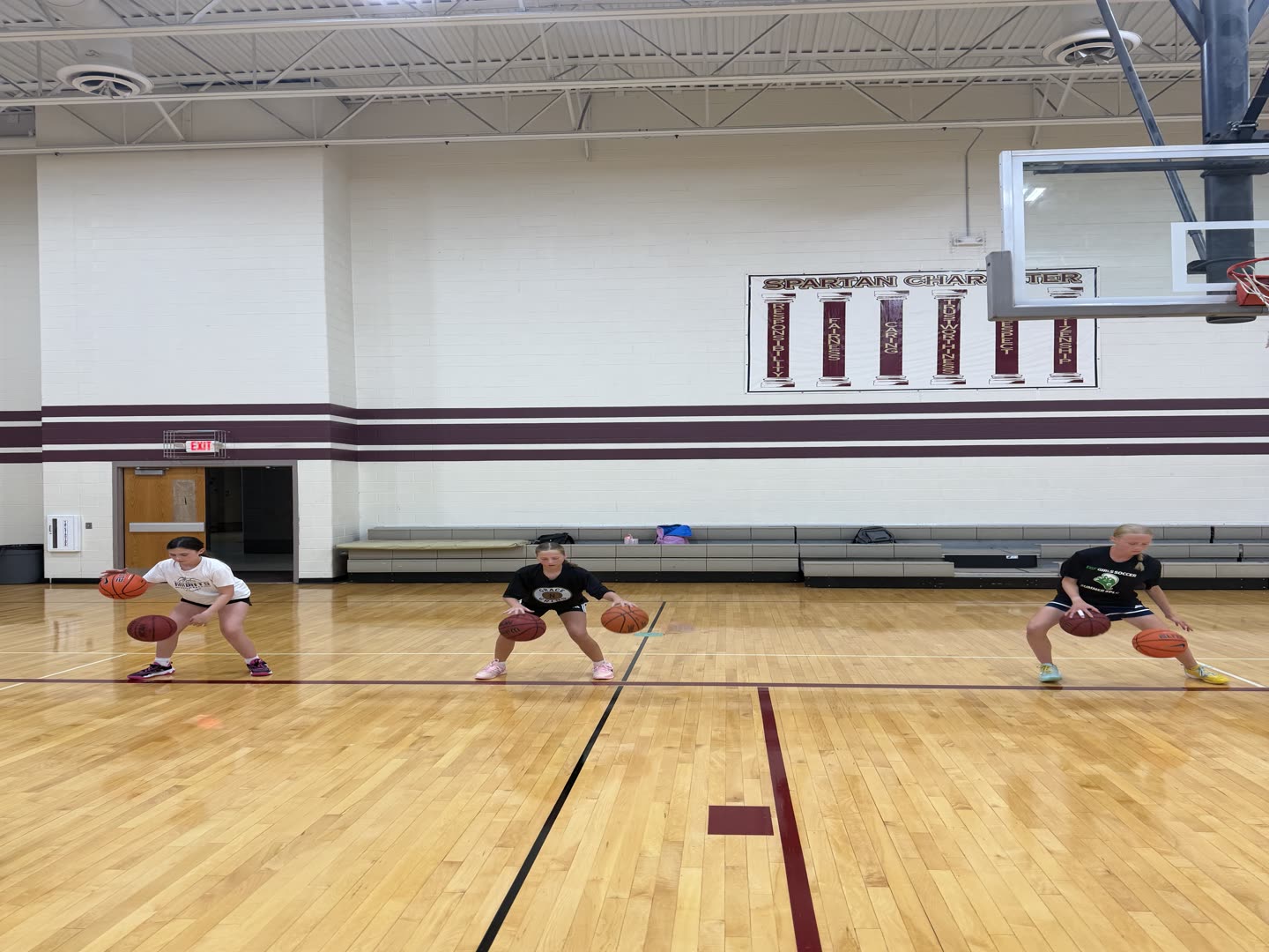 Three Grace N Grind athletes working a two-ball dribble drill