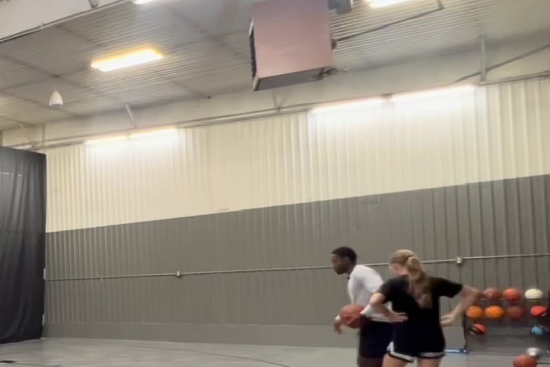A Grace N Grind coach working with an athlete on a midrange shot
